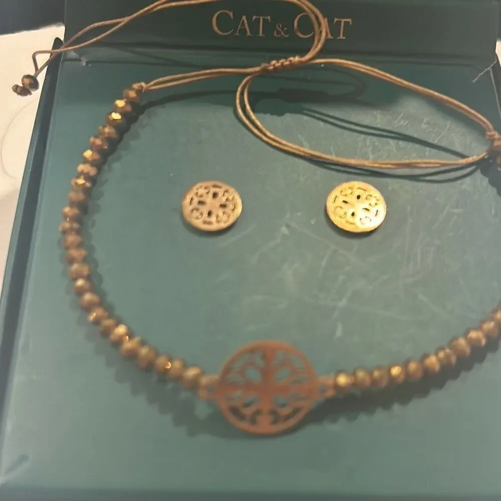 Cat & Cat beaded bracelet and matching earrings copper color.